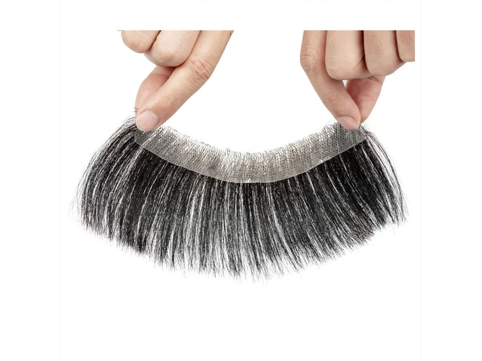 Close-up of the hairpiece being held by fingers.