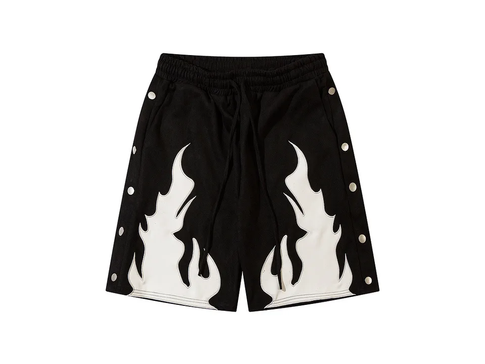 Black sweatshorts with white flame print and side snap buttons.