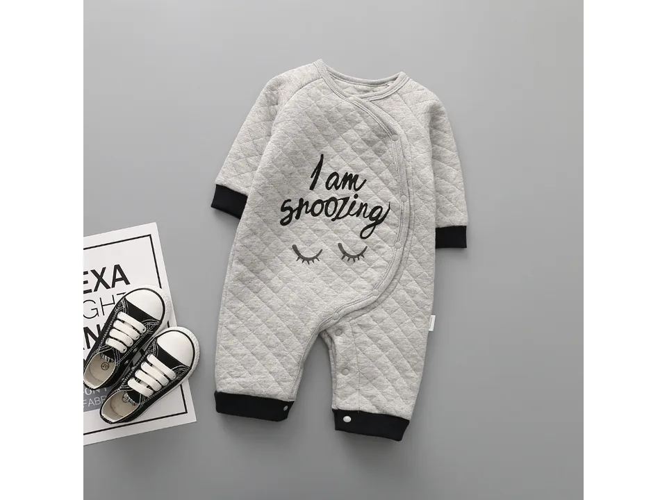 Grey quilted baby romper with 'I am snoozing' text and closed eyes graphic.