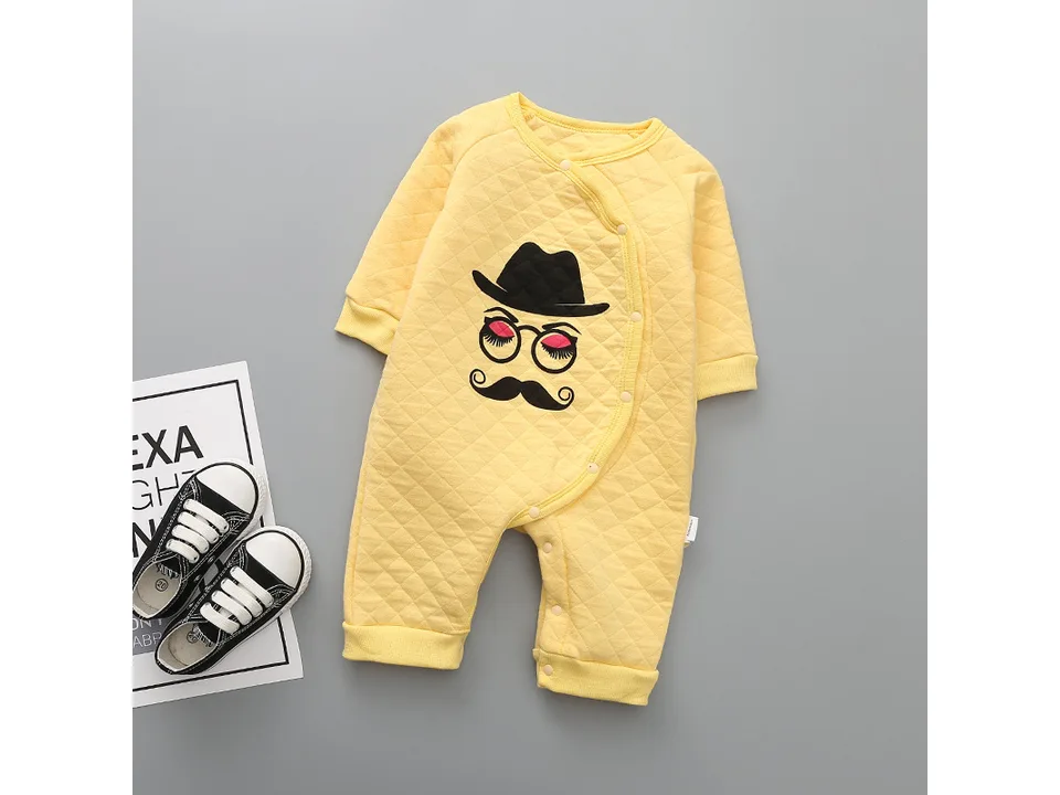 Yellow quilted baby romper with a hat, glasses, and mustache graphic.