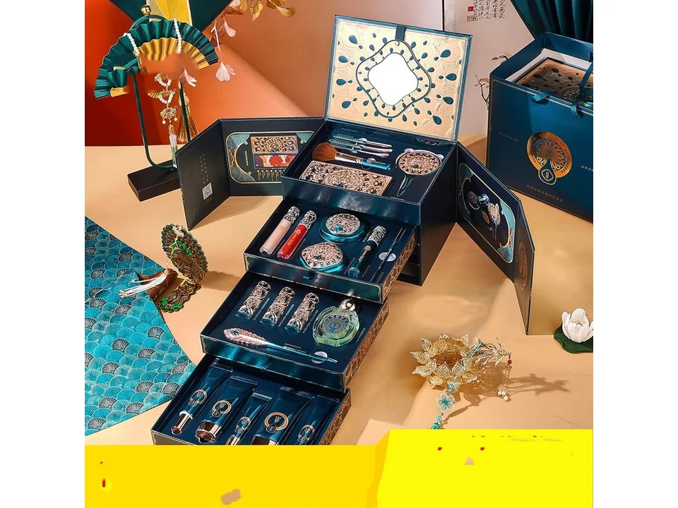 A full gift set of oriental-style makeup and skincare products displayed in an open tiered box.