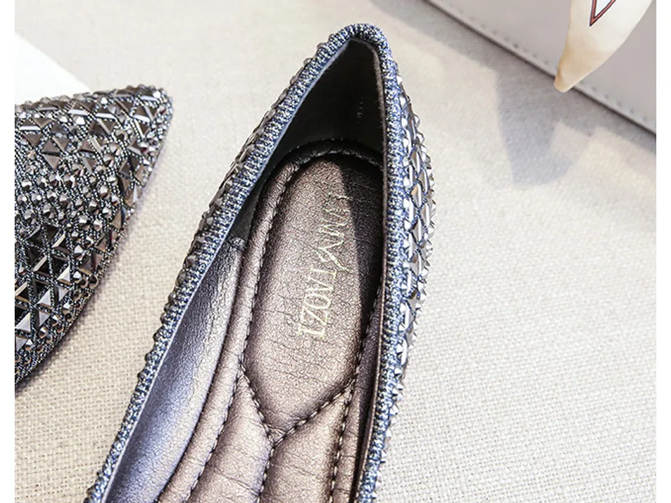 Interior view of the rhinestone flat shoe showing the cushioned insole.