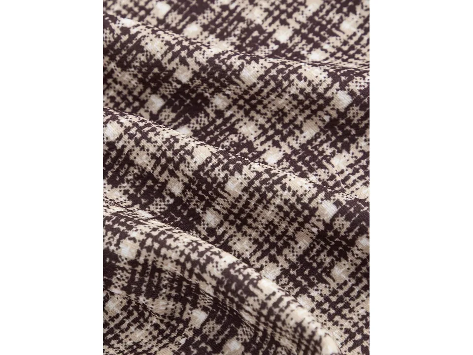 Close-up view of the plaid fabric pattern.