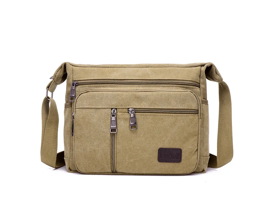 Khaki canvas crossbody messenger bag with multiple zippered pockets.