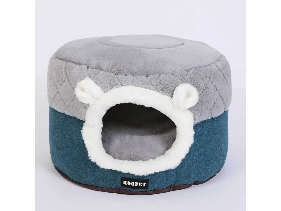 A grey and blue plush pet cave bed with bear-like ears on a white background.