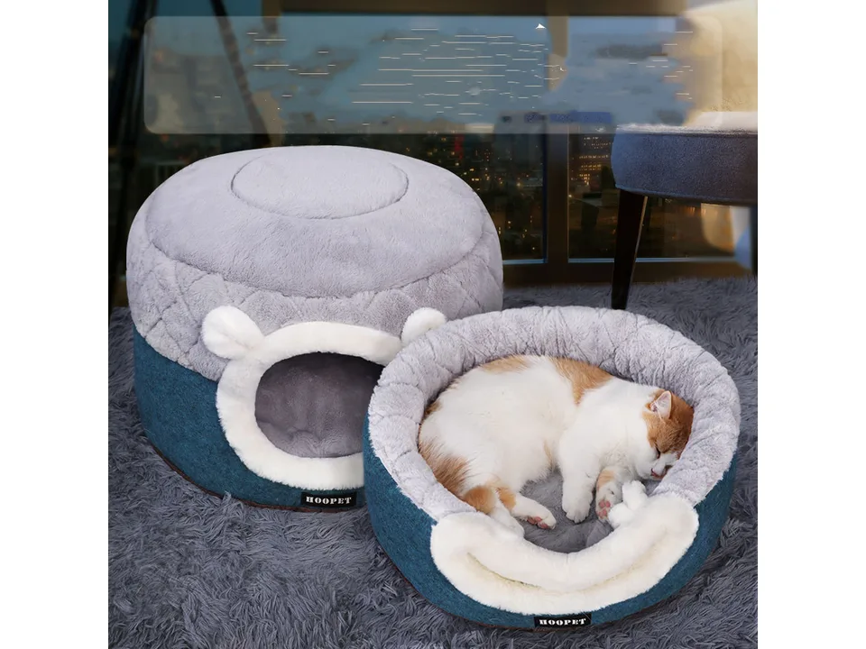 The pet bed shown in both its cave form and its open, flat bed form with a cat sleeping in the open bed.