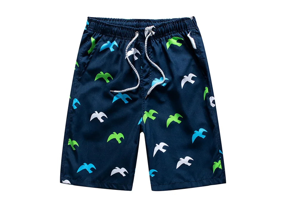 Men's board shorts with a blue background and bird pattern.