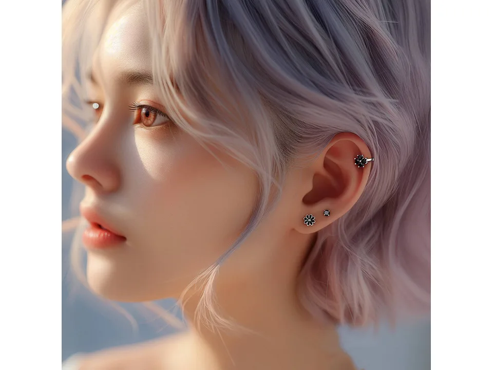 Model wearing clover hoop earrings in her ear.