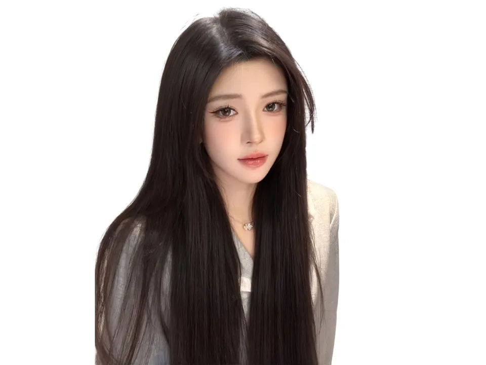 A woman with long, straight black hair and bangs.