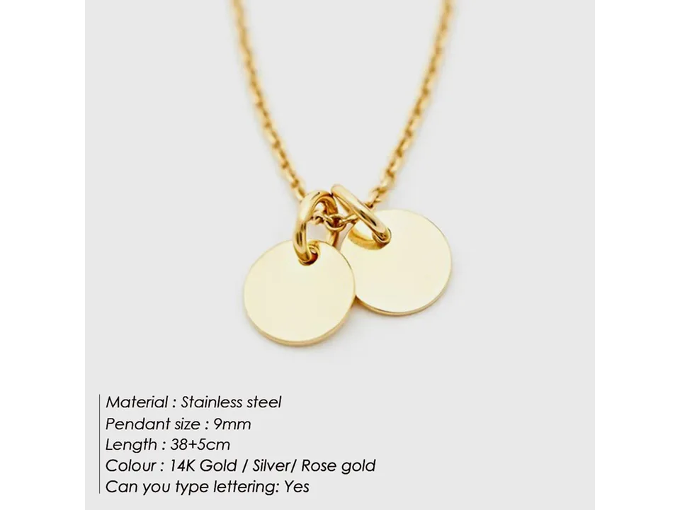Gold necklace with two small round disc pendants.