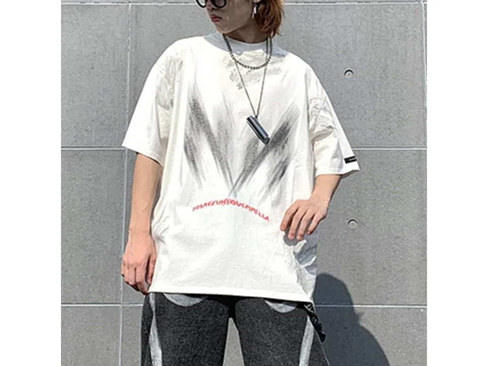 Model wearing the white oversized t-shirt from the front.