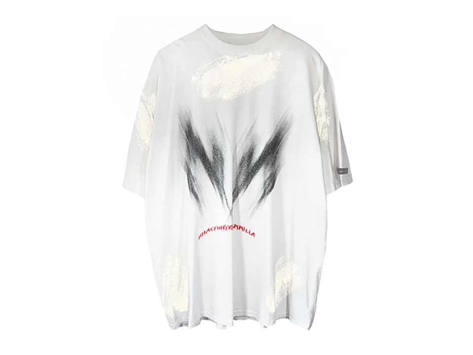 White oversized t-shirt with black graffiti-style print on the front.