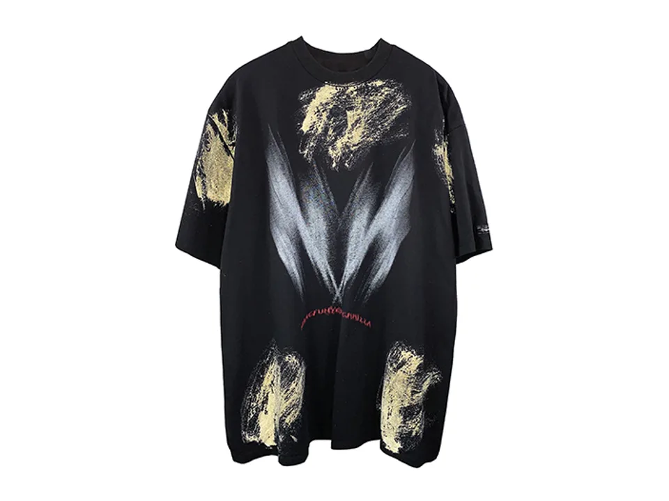 Black oversized t-shirt with white and yellow graffiti-style print on the front.