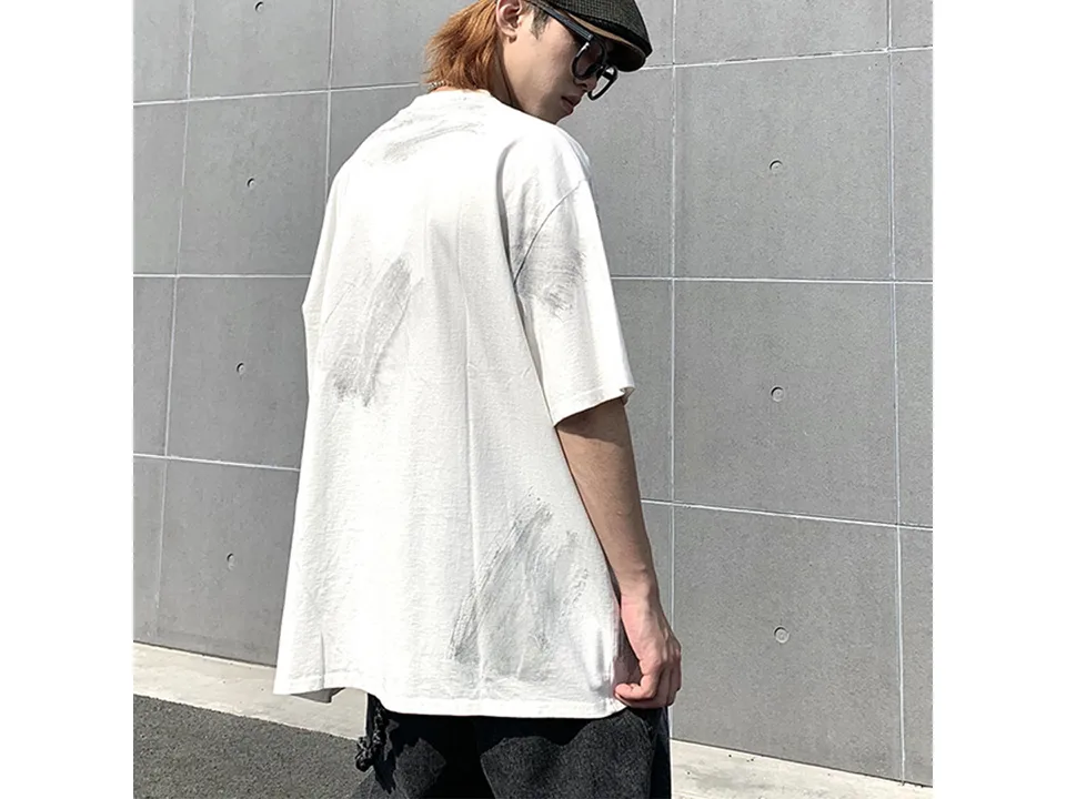 Model wearing the white oversized t-shirt from the back.