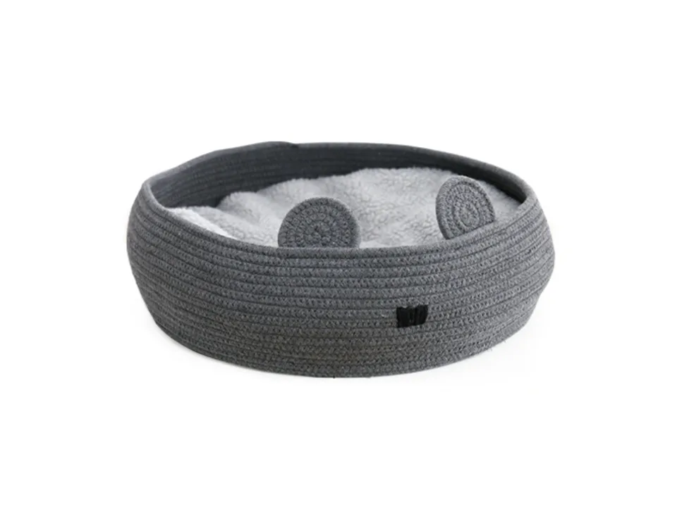Dark grey round woven pet bed with small ears and a soft grey cushion inside.