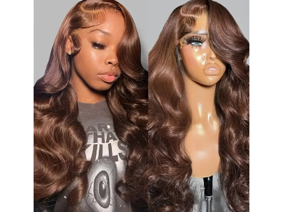 A woman wearing a long, wavy brown wig next to a mannequin head wearing the same wig.