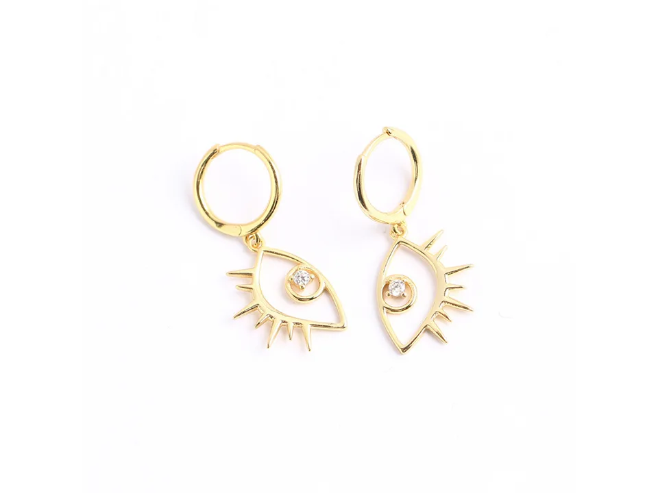 A pair of gold evil eye hoop earrings with white zircon stones.