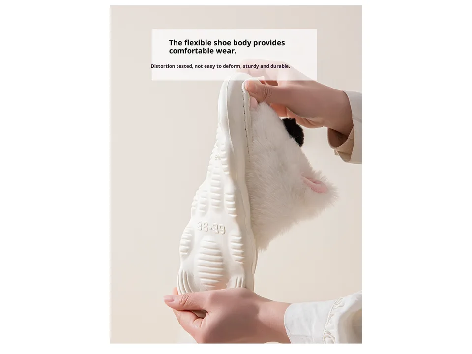 Hands bending a white slipper to show the flexible EVA sole material.