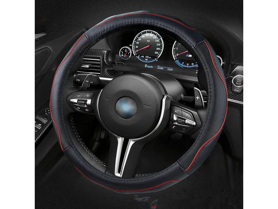 Black leather steering wheel cover with red stitching installed on a car steering wheel.