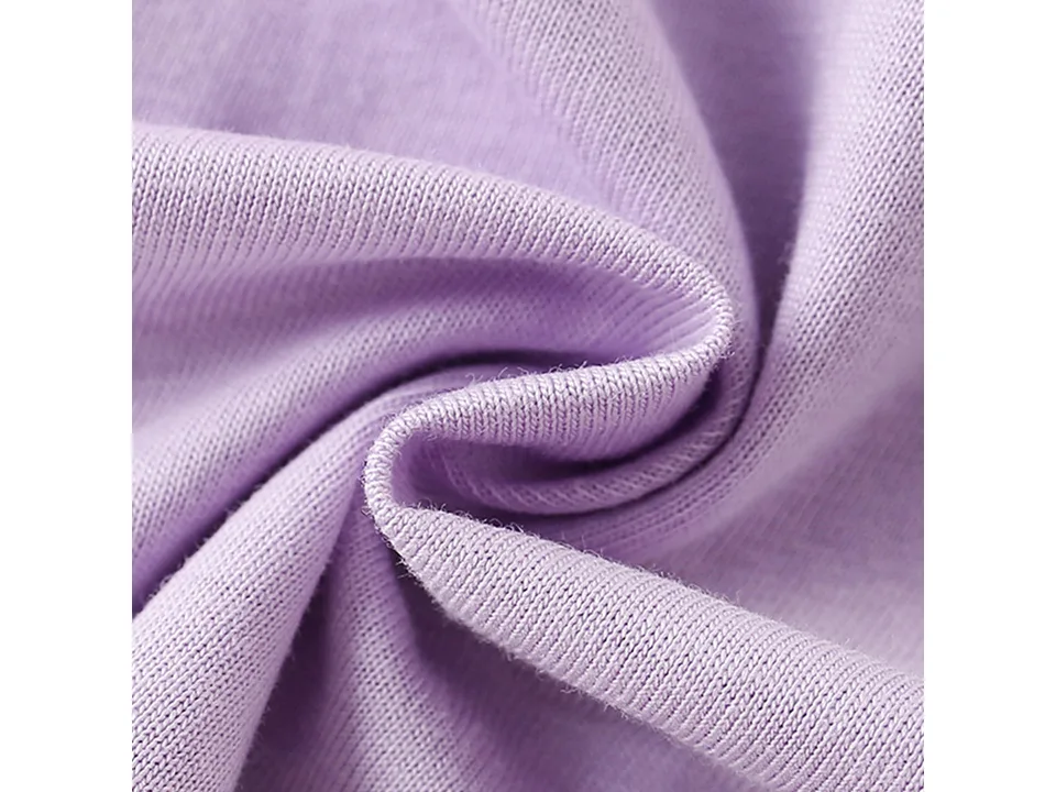 Close-up view of the purple cotton fabric texture.