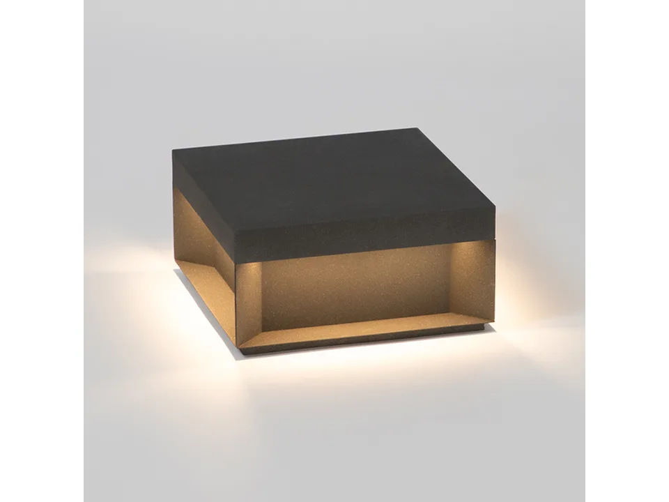 A single square solar pillar light glowing on a plain white background.