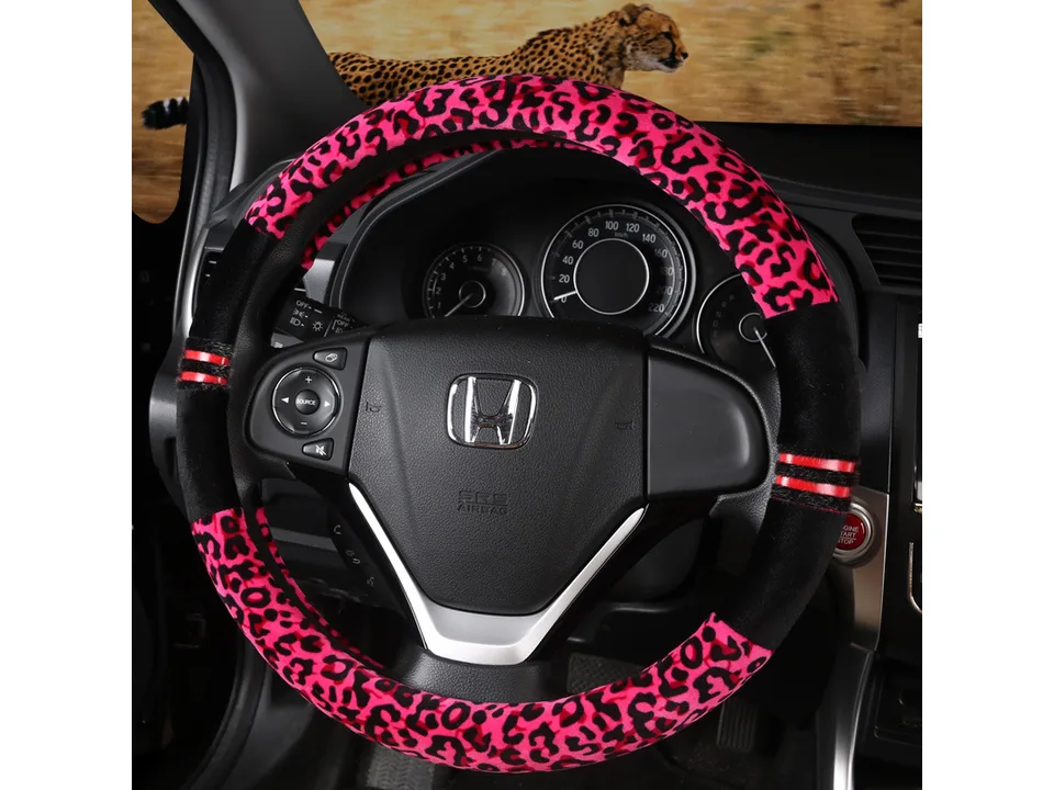 Pink leopard print steering wheel cover installed on a car steering wheel.