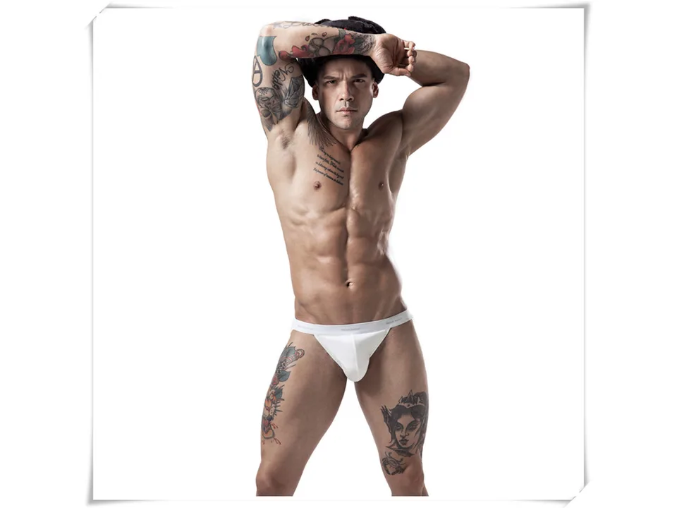 A muscular man wearing white cotton briefs.