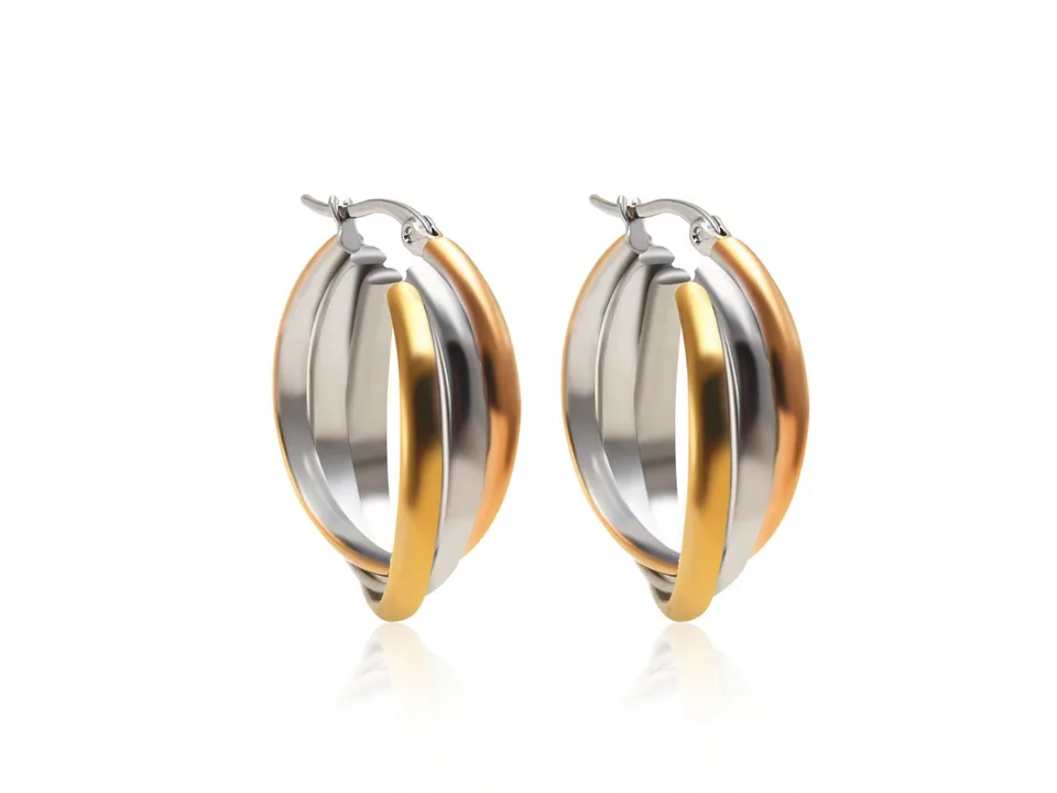 A pair of three-ring overlapping gold earrings isolated on a white background.