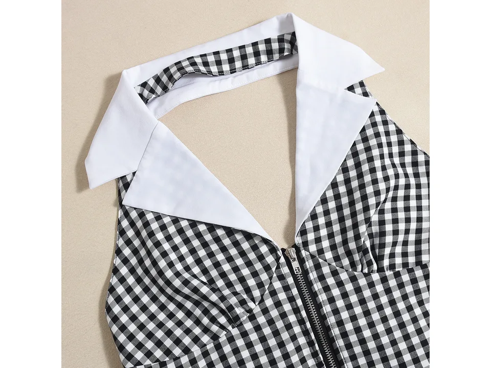 Close-up of the white collar and front zipper on the black and white plaid jumpsuit.