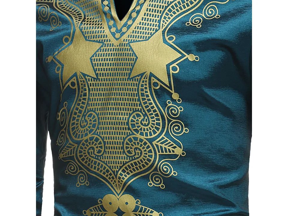 Detailed view of the gold ethnic pattern on the chest of the teal shirt.