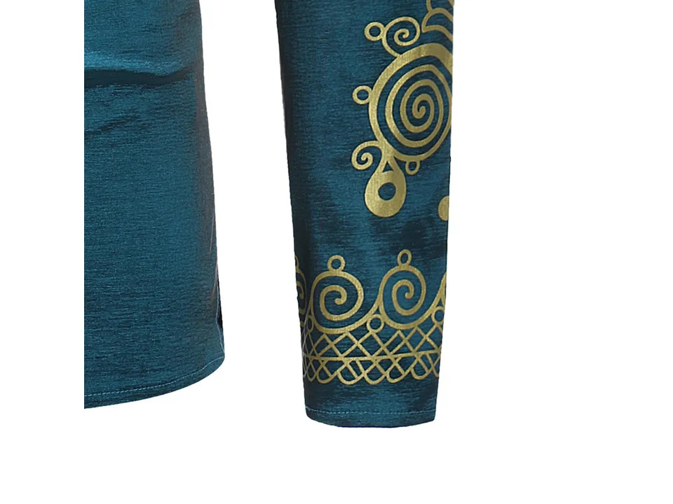 Close-up of the gold ethnic pattern on the sleeve of the teal shirt.
