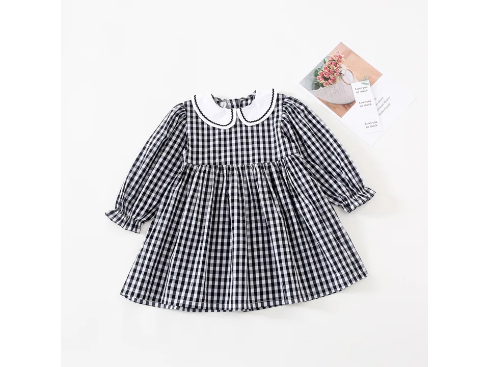 Black and white plaid long sleeve dress with a white Peter Pan collar