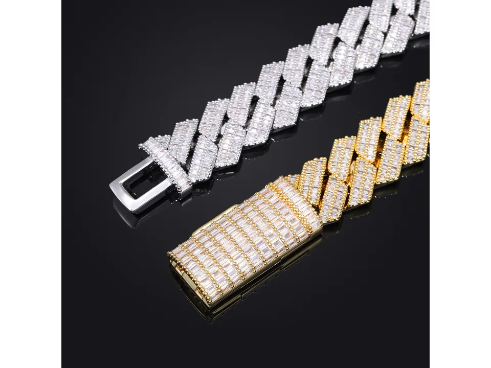 Silver and gold Cuban link bracelets with baguette stones on a black background.