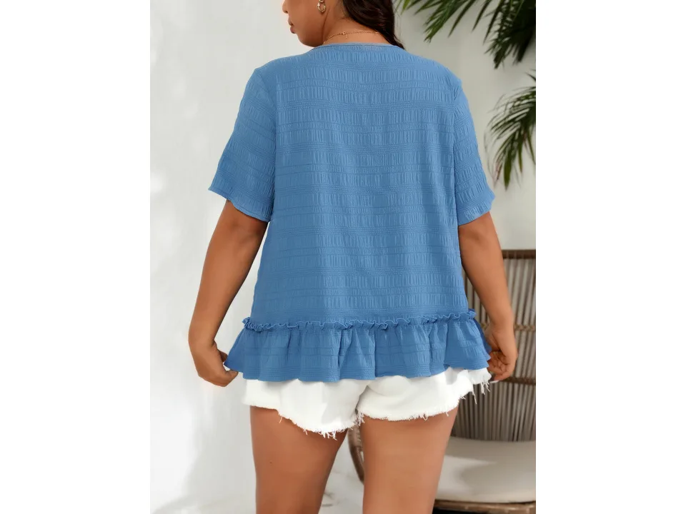 Back view of a model wearing a blue plus-size short-sleeve t-shirt with a ruffled hem.