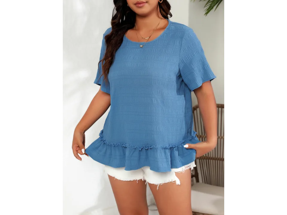 A model wearing a blue plus-size short-sleeve t-shirt with a ruffled hem.