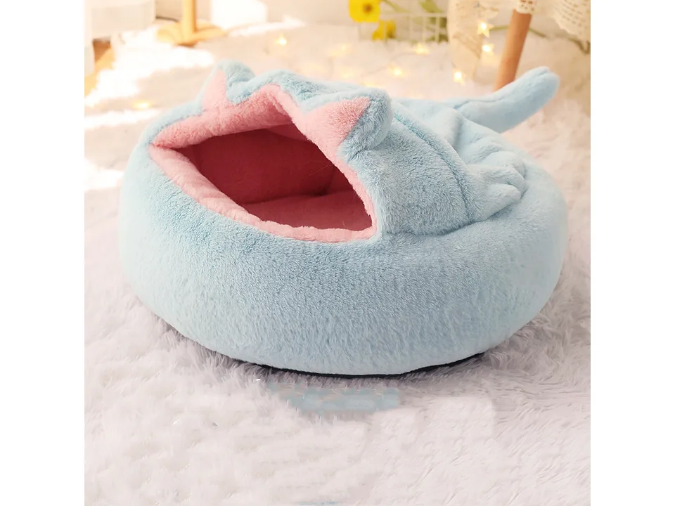Light blue plush enclosed pet bed cave.