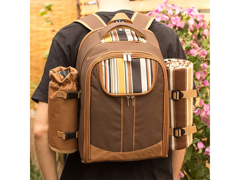 Person wearing a brown striped picnic backpack.
