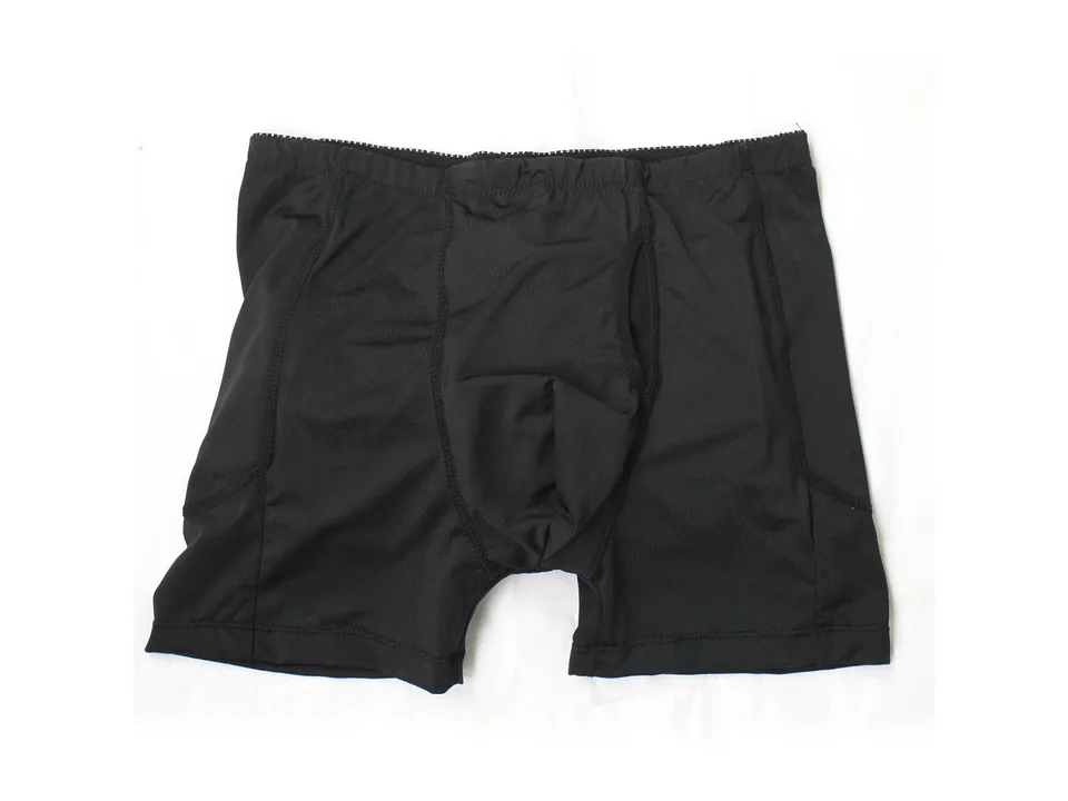 Black compression shapewear shorts laid flat.