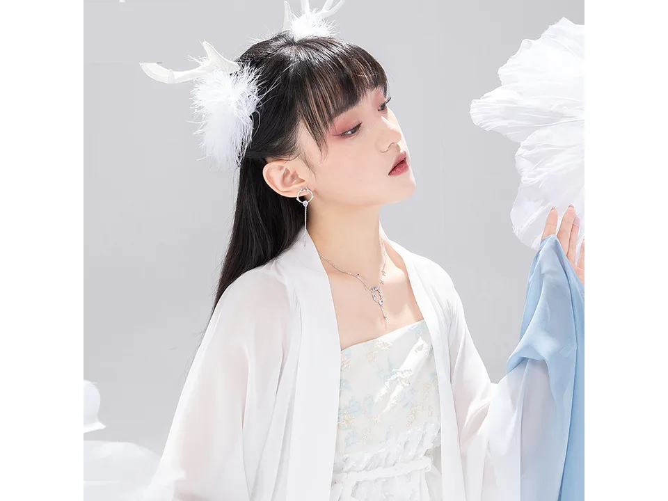 Model wearing the deer antler necklace and matching earrings