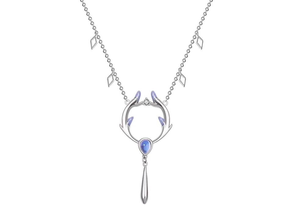 Deer antler pendant necklace with gemstone accent and dangle chain on a white background