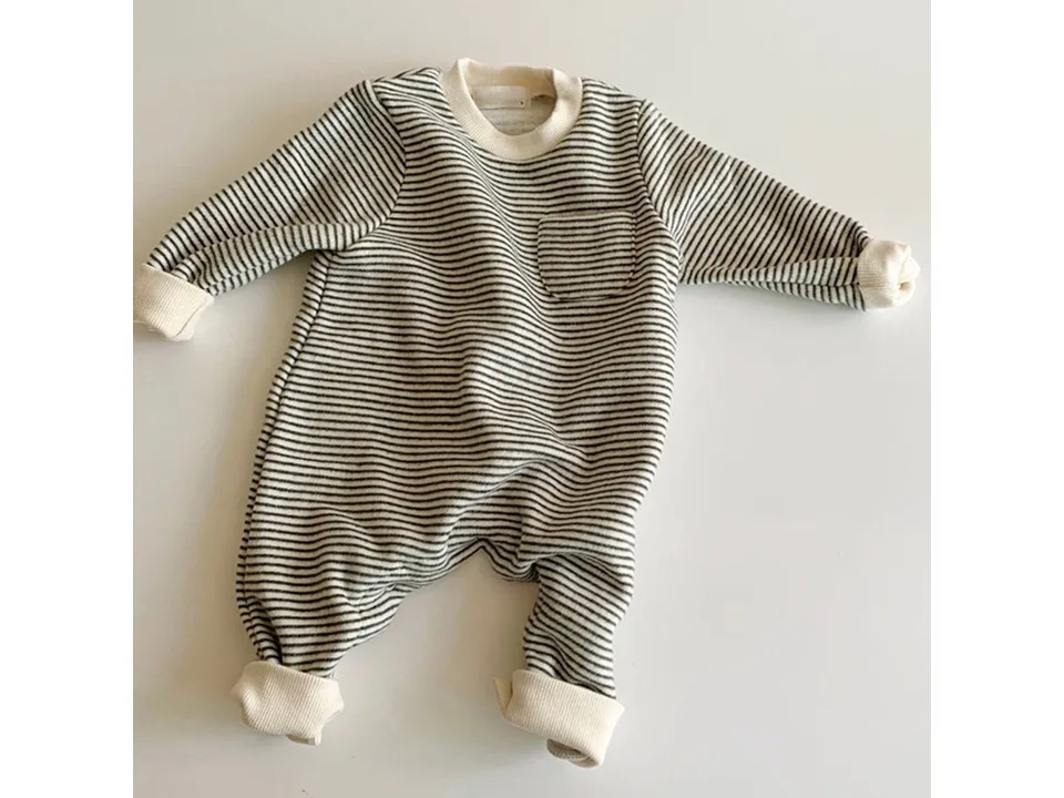 A grey and white striped long-sleeve baby jumpsuit with a small chest pocket.