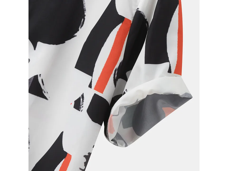 Close-up of the sleeve of the patterned shirt.