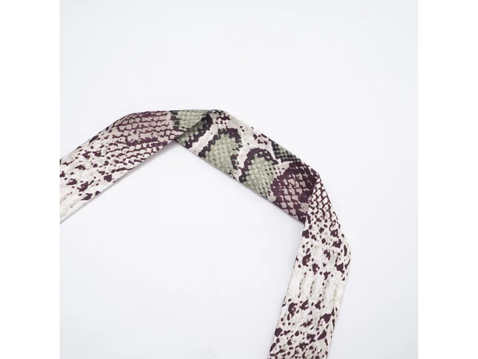 Close-up of the halter neck strap of the jumpsuit.