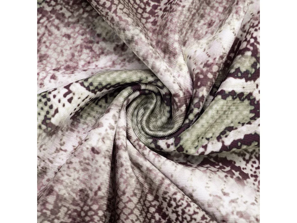 Close-up view of the snake-print fabric texture.