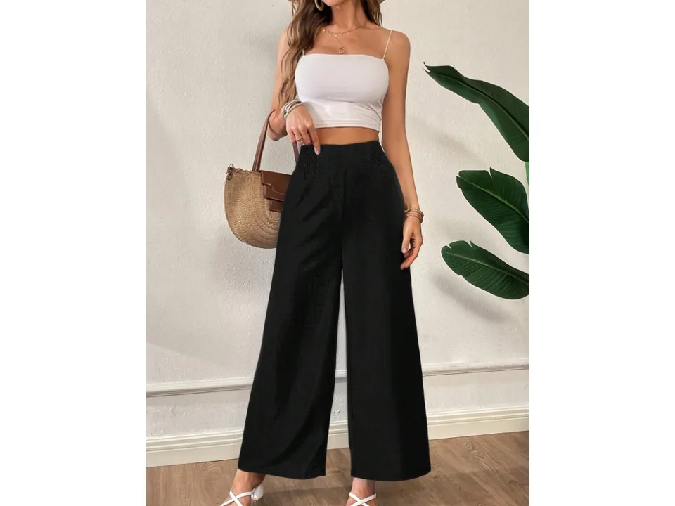 Front view of wide-leg pants in black, showing the high waist and relaxed fit.