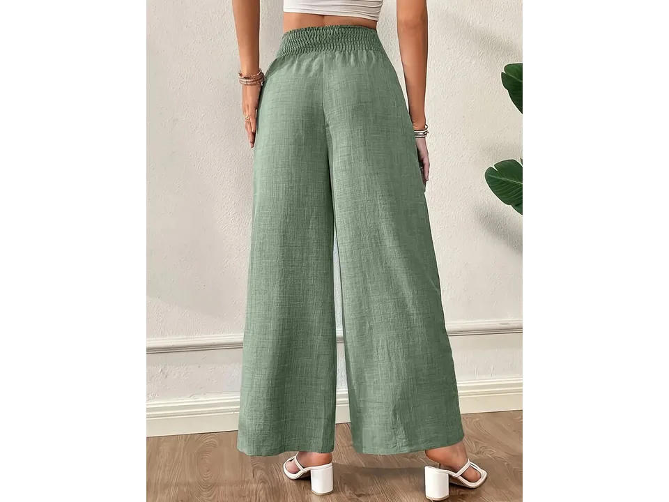 Back view of wide-leg pants in sage green, showing the elastic waistband and fit.
