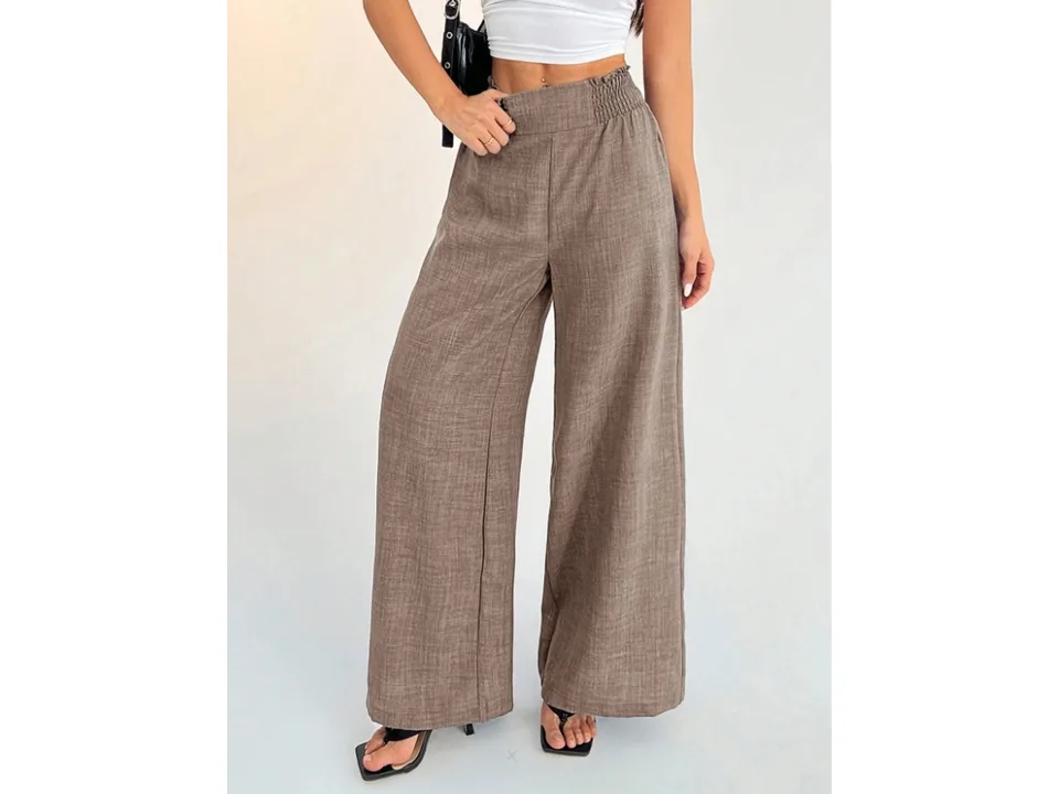 Front view of wide-leg pants in brown, showing the high waist and relaxed fit.