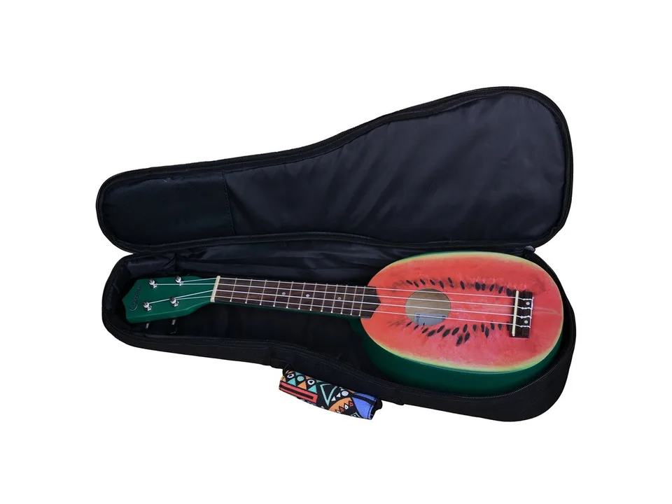 An open ukulele case with a watermelon-themed ukulele inside.