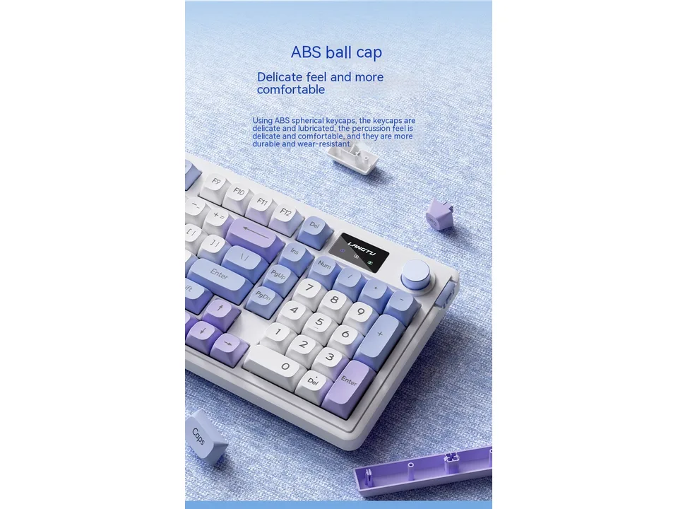 Close-up of the mechanical keyboard showing the spherical keycaps and the digital display screen.