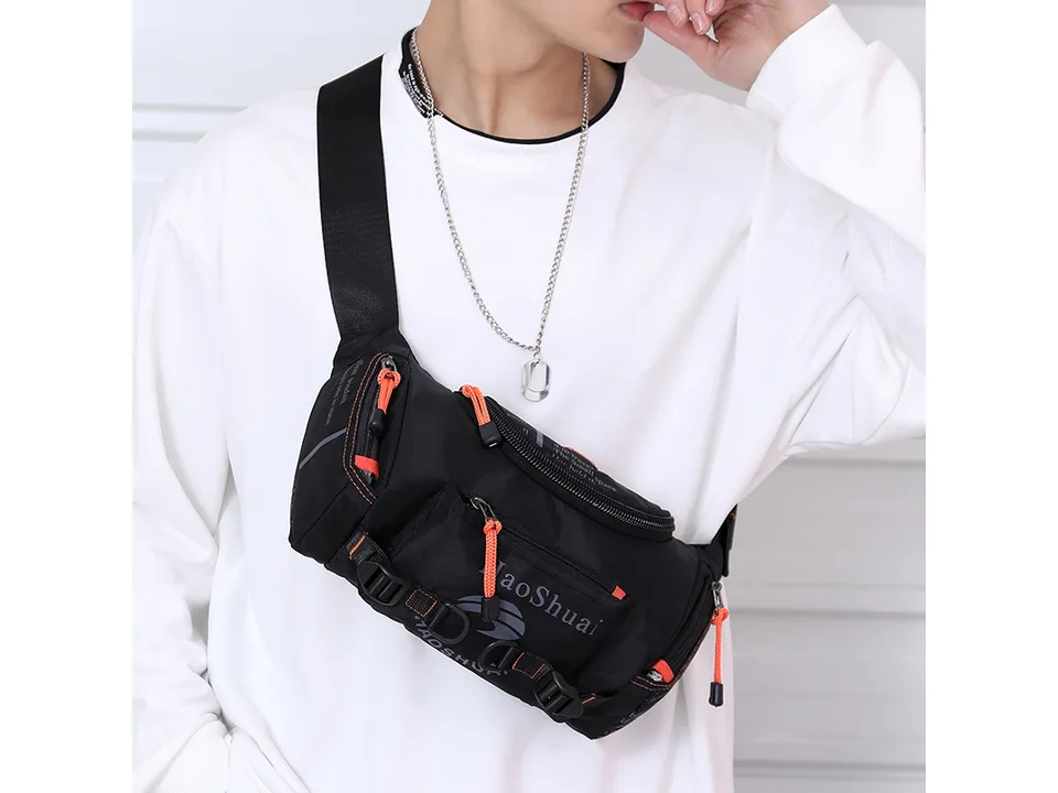 A man wearing a black tactical crossbody bag across his chest.